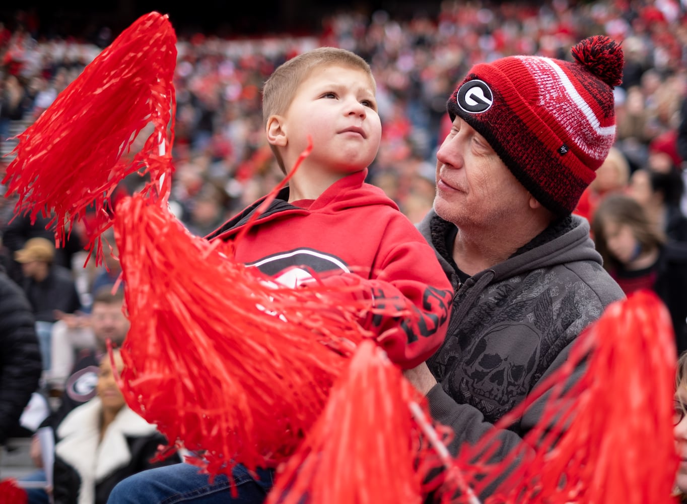 Bobby Self holds his son “Little Bob” as he cheers for the Bulldogs at the beginning of the National Championship celebration Saturday afternoon, Jan. 15, 2022, in Athens. Ben Gray for the Atlanta Journal-Constitution