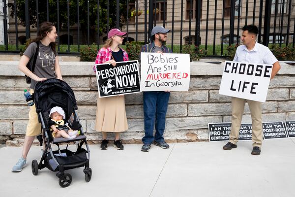 Anti-abortion protesters gather to celebrate Roe v. Wade being struck down by the Supreme Court outside of the Georgia State Capitol on Saturday, June 25, 2022 in Atlanta. (Chris Day/Christopher.Day@ajc.com)