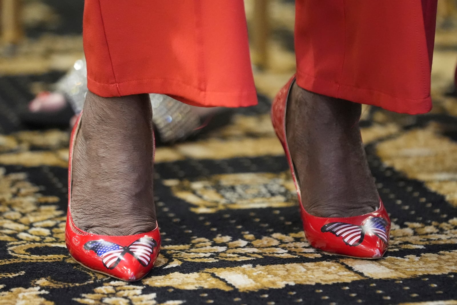 Patriotic shoes are seen prior to Republican presidential nominee former President Donald Trump participating in a roundtable with Latino leaders Tuesday, Oct. 22, 2024 in Doral, Fla. (AP Photo/Alex Brandon)