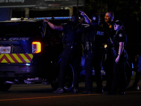 Atlanta police officers investigate at Atlantucky Brewing on Northside Drive after the brewery's owner was forced into a vehicle at gunpoint on Wednesday and later shot.