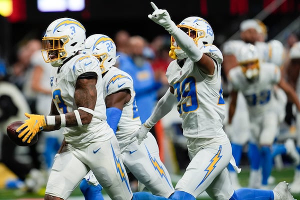 Los Angeles Chargers safety Derwin James Jr. (3) celebrates after an interception during the second half of an NFL football game against the Atlanta Falcons on Sunday, Dec. 1, 2024 in Atlanta. (AP Photo/Mike Stewart)