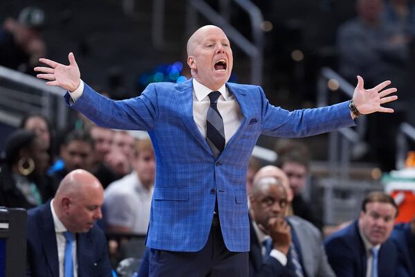 UCLA head coach Mick Cronin questions a call against Wisconsin during the second half of an NCAA college basketball game in the quarterfinals of the Big Ten Conference tournament in Indianapolis, Friday, March 14, 2025. (AP Photo/Michael Conroy)