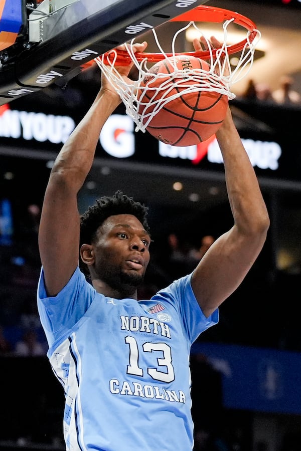 North Carolina forward Jalen Washington dunks against Duke during the first half of an NCAA college basketball game in the semifinals of the Atlantic Coast Conference tournament, Friday, March 14, 2025, in Charlotte, N.C. (AP Photo/Chris Carlson)