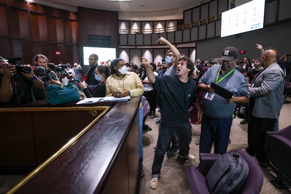 Protesters yell at council members after the vote passed 11 to 4 to approve legislation to fund the training center, on Tuesday, June 6, 2023, in Atlanta. (Jason Getz / Jason.Getz@ajc.com)