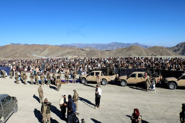 People attend the funeral prayer of Khalil Haqqani, the minister for refugees and repatriation, during his funeral procession in eastern Paktia province, Afghanistan, Thursday, Dec. 12, 2024. (AP Photo/Saifullah Zahir)