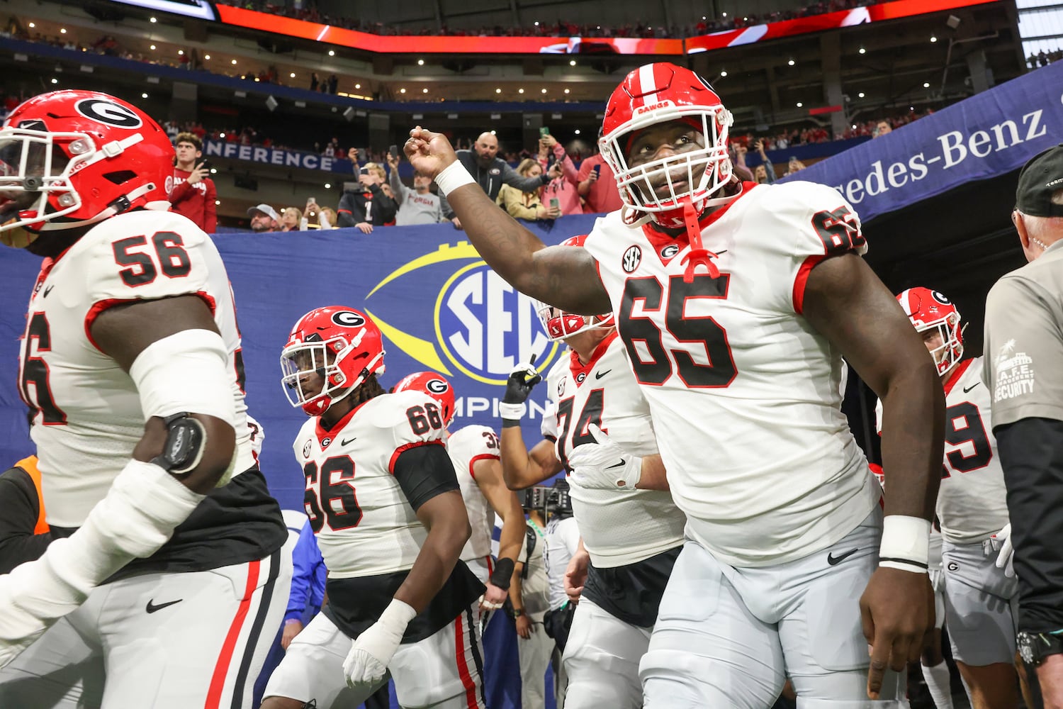 Georgia Bulldogs offensive lineman Amarius Mims (65) fires up his teammates before facing the Alabama Crimson Tide in the SEC Championship football game at the Mercedes-Benz Stadium in Atlanta, on Saturday, December 2, 2023. (Jason Getz / Jason.Getz@ajc.com)