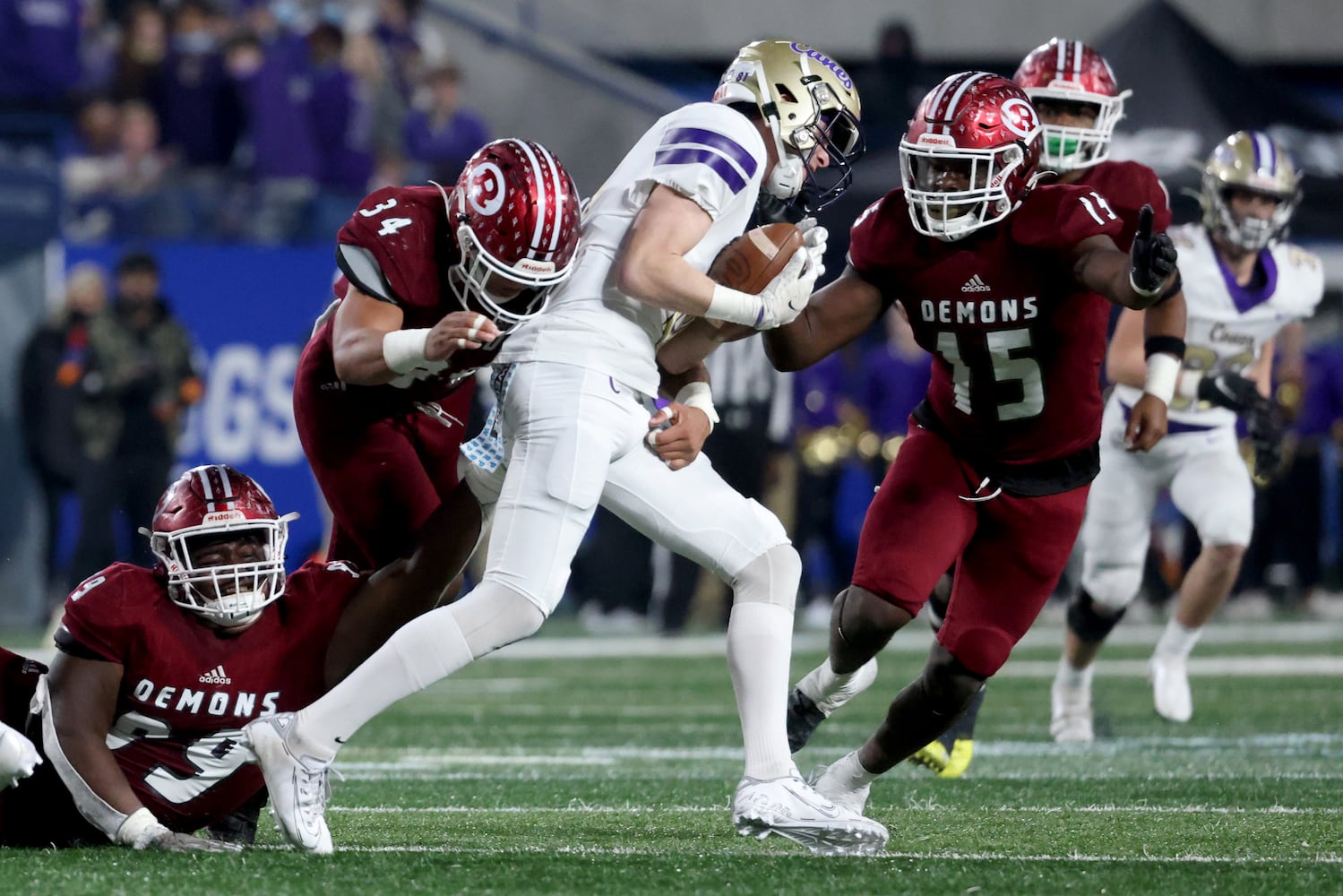 Cartersville wide receiver Phillip Schiltz (81) is tackled by Warner Robins defenders Javar Jordan (99), Ahmad Walker (34), and Jacarious Carter (15) in the second half of the Class 5A state high school football final at Center Parc Stadium Wednesday, December 30, 2020 in Atlanta. Warner Robins won 62-28. JASON GETZ FOR THE ATLANTA JOURNAL-CONSTITUTION