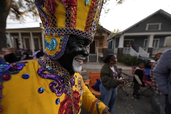 A member of the Zulu Tramps walks down Jackson Ave before the start of the Mardi Gras Day parade on Tuesday, March 4, 2025 in New Orleans. (AP Photo/Gerald Herbert)