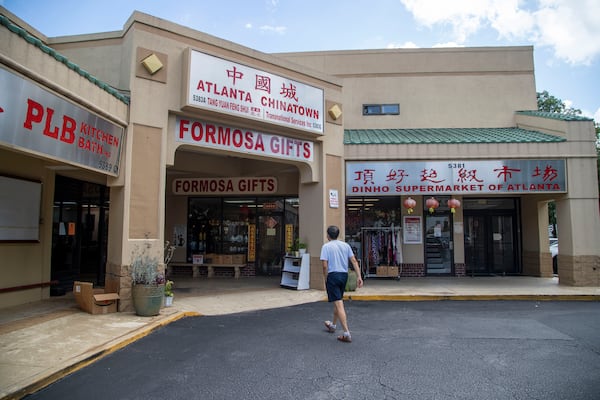 A man prepares to enter the Atlanta Chinatown Shopping Mall in Chamblee, Friday, July 31, 2020. (ALYSSA POINTER / ALYSSA.POINTER@AJC.COM)