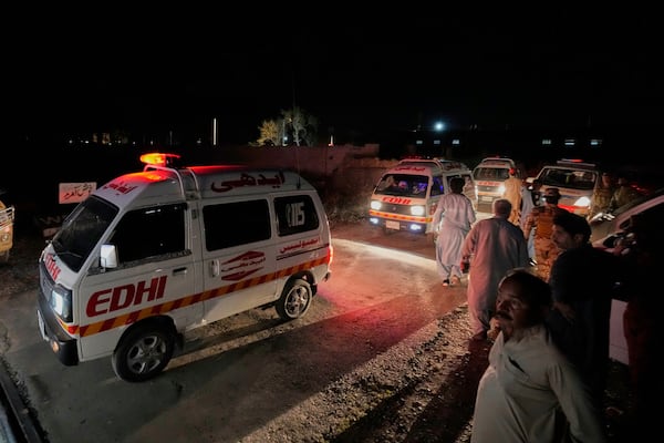 Ambulances carrying wounded survivors rescued by security forces from a passenger train attacked by insurgents leave a railway station in Much, Pakistan's southwestern Balochistan province, Wednesday, March 12, 2025. (AP Photo/Anjum Naveed)