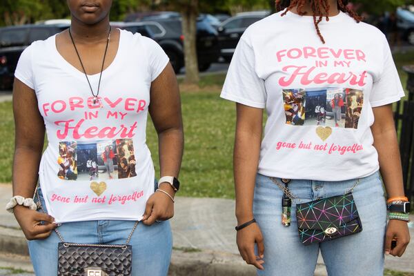 Najah White (right) and Star White (left) show off custom-made t-shirts during an event honoring shooting victim Bre'Asia Powell on Wednesday, May 31, 2023, at the C.T. Martin Natatorium and Recreation Center in Atlanta. Powell was killed on Memorial Day weekend at a gathering at Benjamin E. Mays High School, which she attended. CHRISTINA MATACOTTA FOR THE ATLANTA JOURNAL-CONSTITUTION.