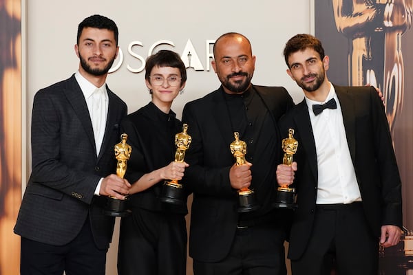 Basel Adra, from left, Rachel Szor, Hamdan Ballal, and Yuval Abraham, winners of the award for best documentary feature film for "No Other Land," pose in the press room at the Oscars on Sunday, March 2, 2025, at the Dolby Theatre in Los Angeles. (Photo by Jordan Strauss/Invision/AP)