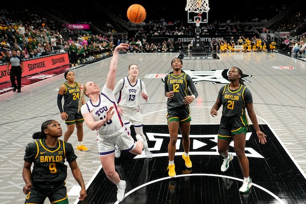 TCU guard Hailey Van Lith (10) puts up a shot during the second half of an NCAA college basketball game against Baylor for the Big 12 women's tournament championship Sunday, March 9, 2025, in Kansas City, Mo. (AP Photo/Charlie Riedel)