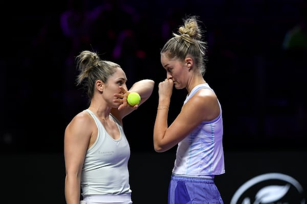 Canada's Gabriela Dabrowski, left, talks to New Zealand's Erin Routliffe during their match against Taylor Townsend of the U.S. and Katerina Siniakova of the Czech Republic in the women's doubles final of the WTA finals at King Saud University Indoor Arena, in Riyadh, Saudi Arabia, Saturday, Nov. 9, 2024. (AP Photo)