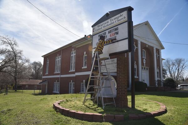 A church staff member works outside Warren Temple United Methodist Church where a ceremony will take place Saturday to memorialize the lynching of Austin Callaway and three other men. The church’s leadership tried to get justice for Callaway in 1940 but authorities refused to investigate the crime. HYOSUB SHIN / HSHIN@AJC.COM