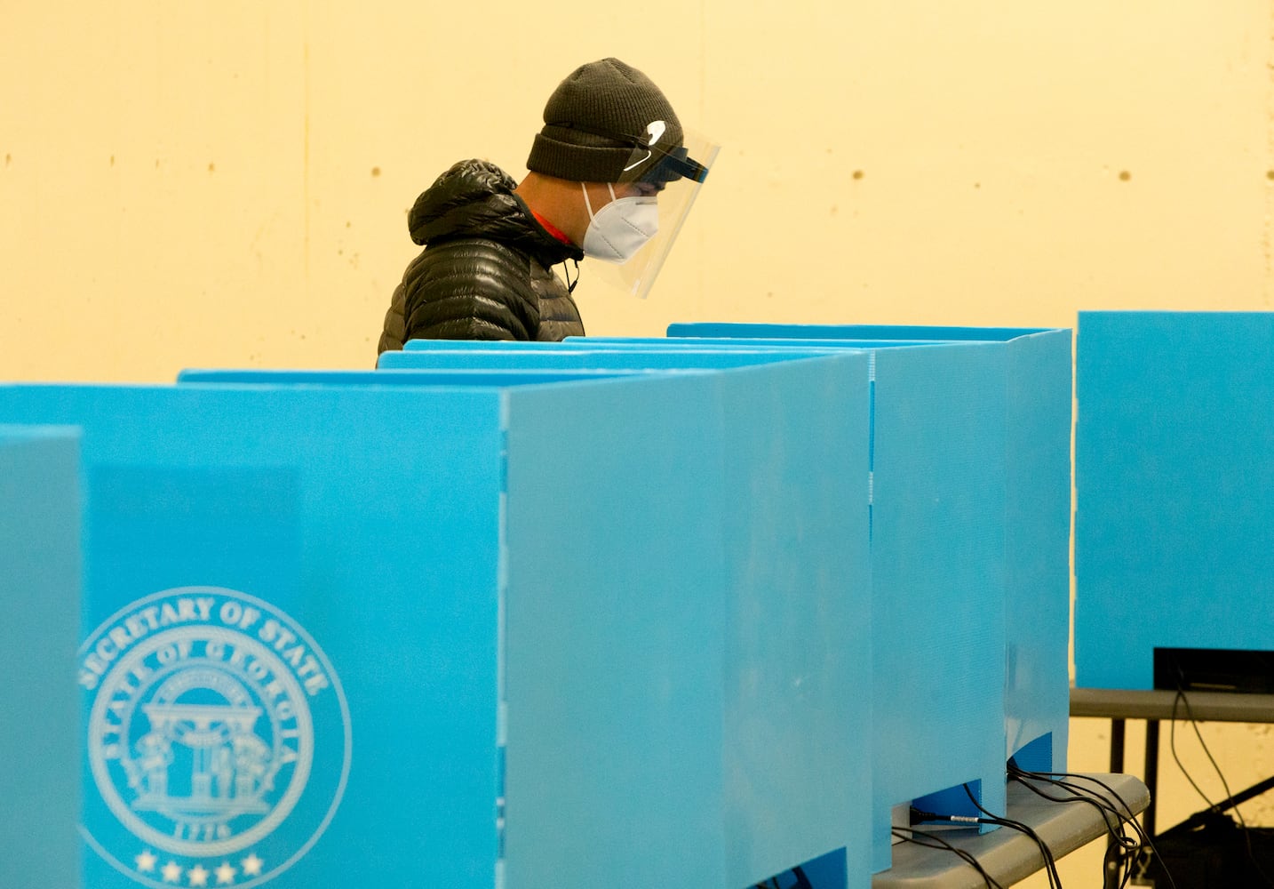 A voters casts his ballots at the Coan Park Recreation Center on election day Nov 3rd, 2020. The poll manager reported a lighter than normal turn out early in the day but had a good early voting numbers. PHIL SKINNER FOR THE ATANTA JOURNAL-CONSTITUTION