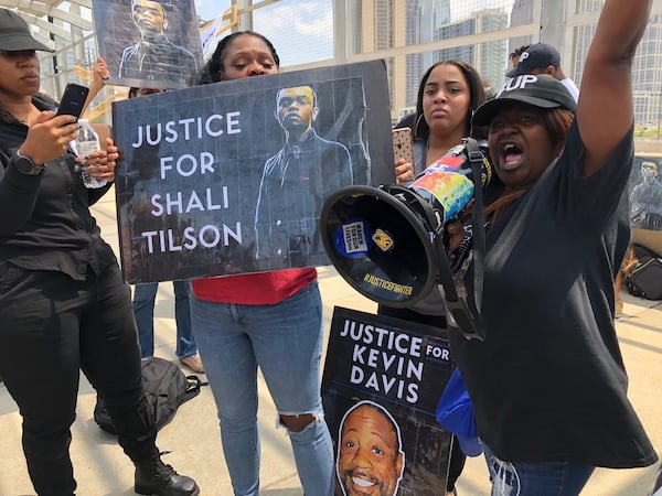 Tynesha Tilson (right), the mother of Shali Tilson, speaks out against her son’s death during an Aug. 24 protest on the 17th St. bridge near Atlantic Station in Atlanta. Shali Tilson, 22, died in March while being held at the Rockdale County Jail. WILLOUGHBY MARIANO/wmariano@ajc.com