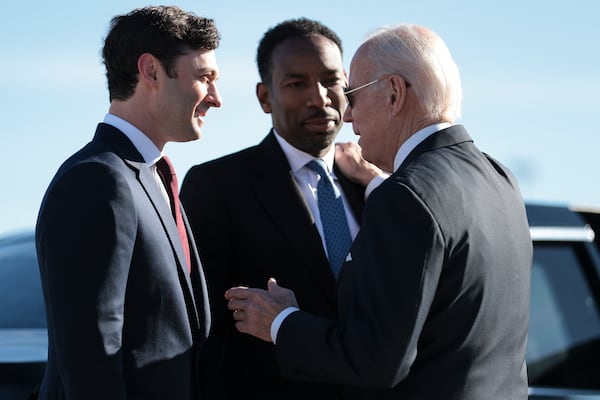 FILE — President Joe Biden, right, greets Atlanta Mayor Andre Dickens, center, and Sen. Jon Ossoff (D-Ga.) as he arrives at the Hartsfield-Jackson Atlanta International Airport in Atlanta, Jan. 15, 2023. Atlanta, Chicago and New York are finalists to host the 2024 Democratic Convention, and local Democrats are eager to bend Biden’s ear to host his formal nomination event. (Oliver Contreras/The New York Times)