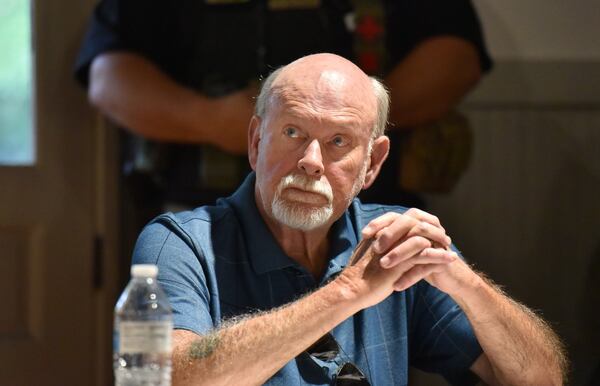 Councilman Jim Cleveland reacts during public hearing and regular meeting at Hoschton Train Depot in Hoschton on Thursday, May 30, 2019. Mayor Theresa Kenerly and Councilman Jim Cleveland have been under fire for racial comments regarding the handling of a black candidate for city administrator in March. HYOSUB SHIN / HSHIN@AJC.COM