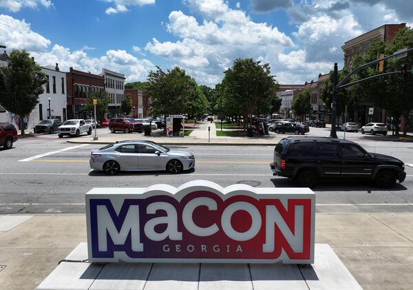 The view down Poplar Street in downtown Macon, the focal point of the city's most recent shopping- and dining-district revival. (Hyosub Shin / AJC)