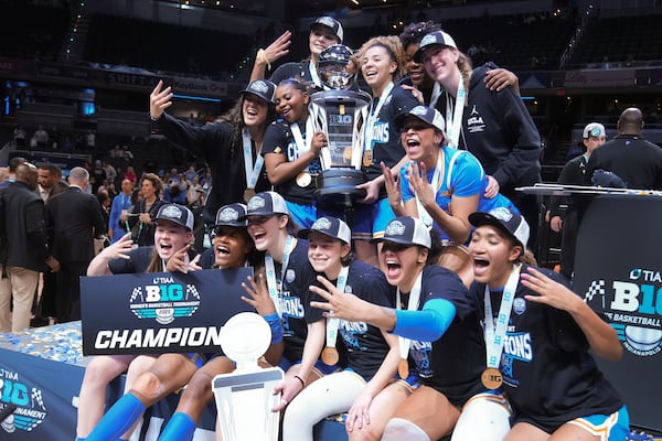 UCLA players celebrate after an NCAA college basketball game against Southern California in the championship of the Big Ten Conference tournament in Indianapolis, Sunday, March 9, 2025. (AP Photo/Michael Conroy)