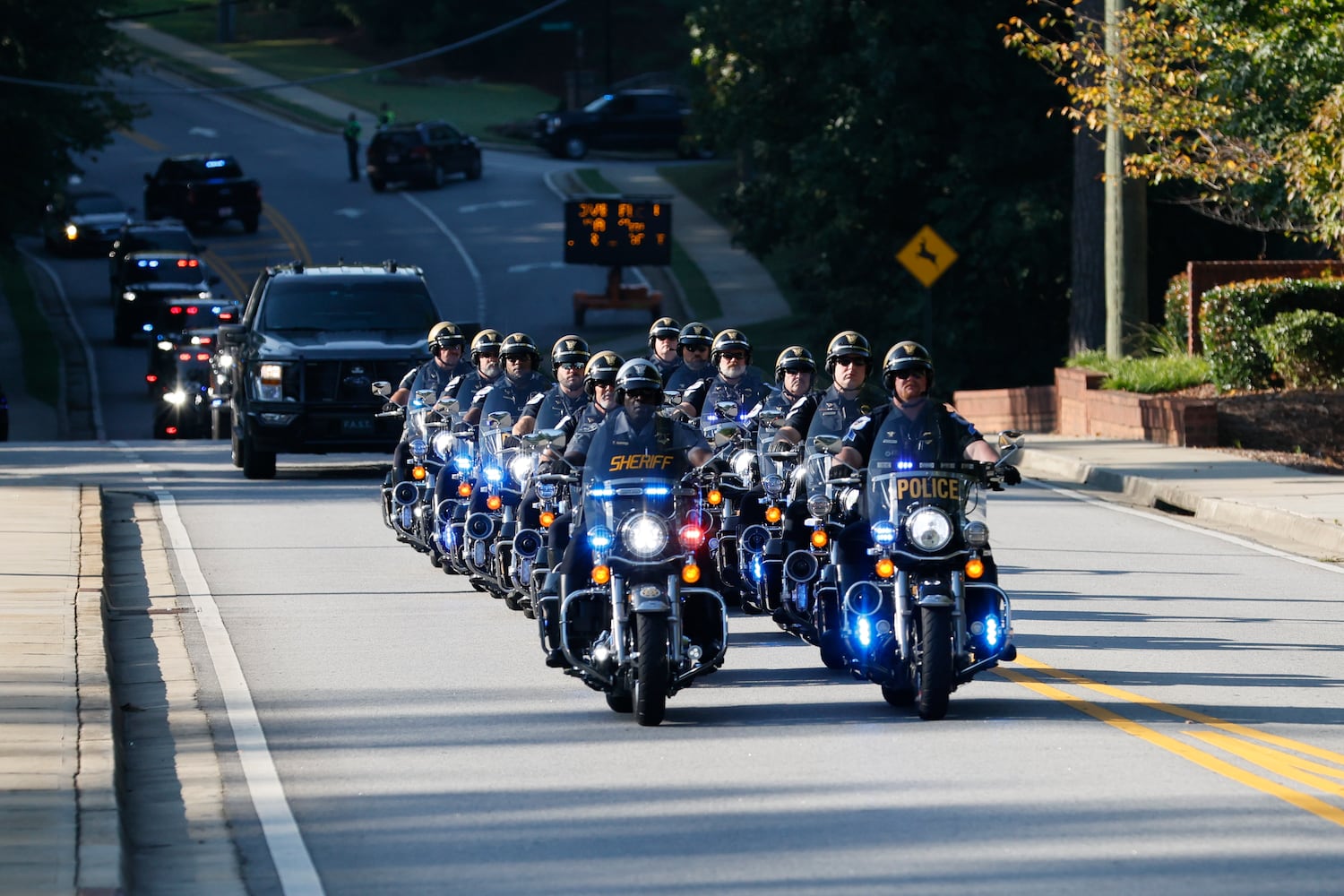 A motorcade leads the caravan, escorting the family of Deputy Jonathan Koleski to the NorthStar church for his funeral service on Wednesday, September 14, 2022. Wednesday, September 14, 2022. Miguel Martinez / miguel.martinezjimenez@ajc.com