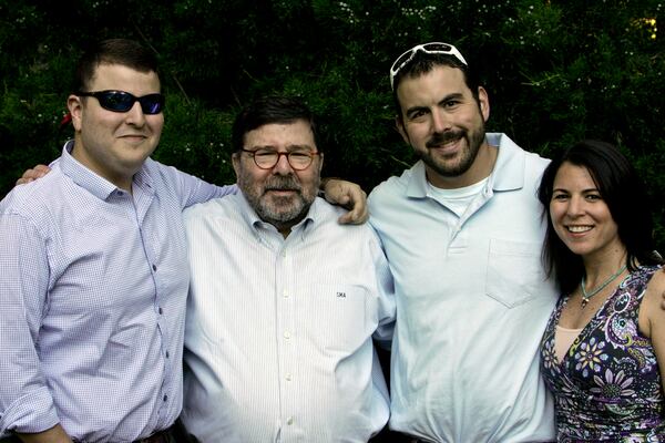 Pictured are from left to right:  Son Joshua Alterman, longtime Horseradish Grill owner Steve Alterman, son Daniel Alterman, and daughter Rachel Alterman Wallack.  They are in the garden at the restaurant where many family events were held.