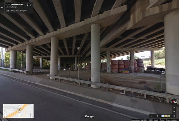 This image from Google Maps Street View shows the spools of high-density polyethylene conduit in September 2014, stored under the portion of I-85 that collapsed last week. The conduit is blamed as causing the fire to burn hot enough to collapse the bridge.