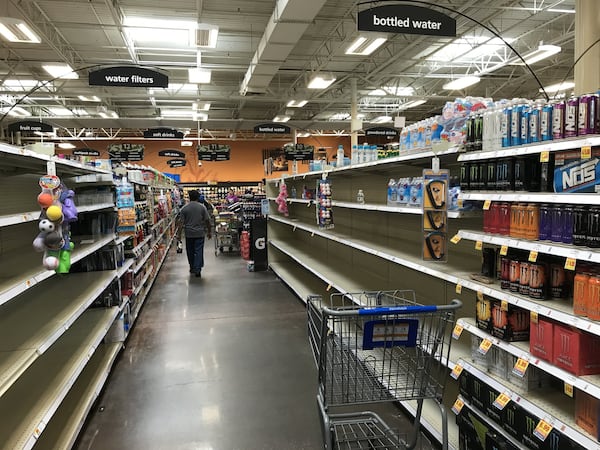 The bottled water aisle at the Kroger store on DeKalb Industrial Way and North Decatur Road was picked clean Wednesday. A massive water main break caused issues throughout DeKalb County. SHANE HARRISON / SHANE.HARRISON@AJC.COM