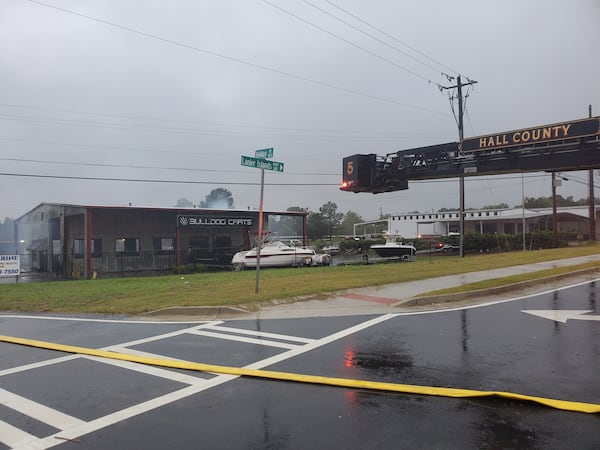 Hall and Gwinnett firefighters worked to extinguish the fire at Bulldog Carts around 8:15 a.m.