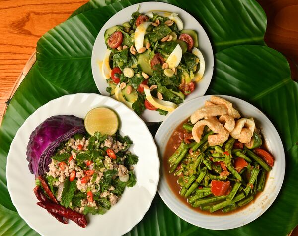 Here are three Lao salads to enjoy this summer and beyond: Yum Salat (Lao Salad with Egg Dressing) (top), Thum Mak Tua (Long Bean Salad) (bottom right) and Laab Gai (Chicken Salad) (bottom left). (Styling by Ilene Rouamvongsor / Chris Hunt for the AJC)