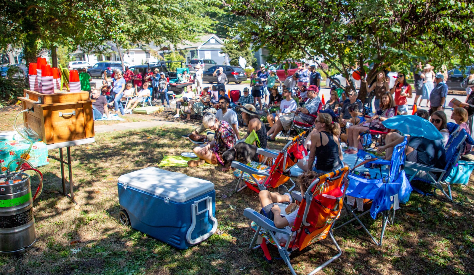 Guests listen to Tuesday Nights Live play during Oakhurst Porchfest in  2021. Steve Schaefer for The Atlanta Journal-Constitution