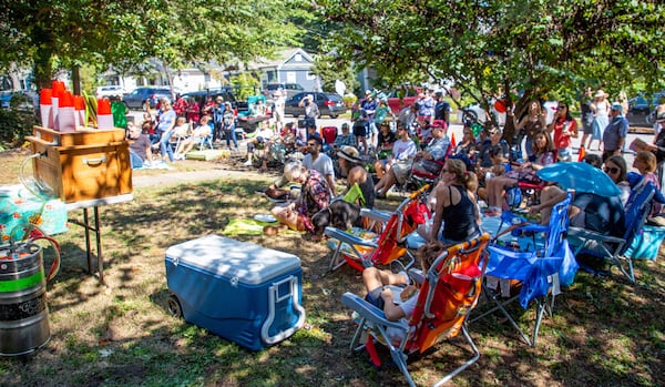 Guests listen to Tuesday Nights Live play during Oakhurst Porchfest in  2021. Steve Schaefer for The Atlanta Journal-Constitution