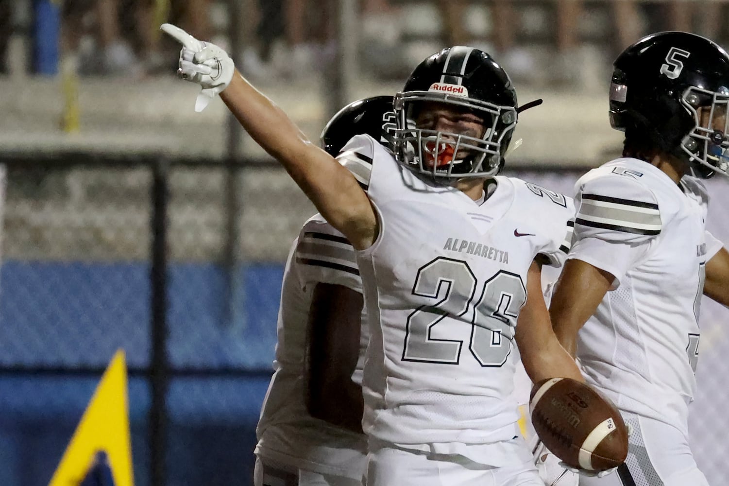 Alpharetta running back Jake Gil (26) reacts after running for a first down in the second half against Chattahoochee at Chattahoochee high school Friday, September 25, 2020 in Johns Creek, Ga. Alpharetta won 21-7. JASON GETZ FOR THE ATLANTA JOURNAL-CONSTITUTION