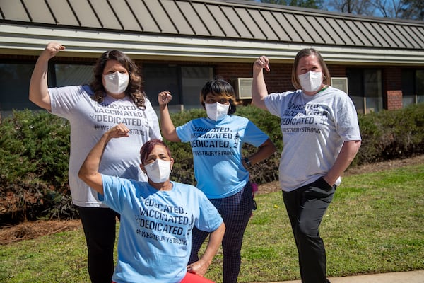  Westbury Medical Care and Rehab staff, left to right, Jennifer Vasil, Octeria Odom, Tiffany Covington, and Laura Barber pose outside of the facility in Jackson. Barber is the Assistant Director for Nursing and the infection control preventionist of the medical facility, and helped with getting the COVID-19 spread in the facility under control. (Alyssa Pointer / Alyssa.Pointer@ajc.com)