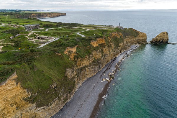 This photo taken in 2019 shows the cliffs that President Reagan's "boys of Pointe du Hoc" had to scale to take out the big German guns that were pounding the invading Allied forces on the Normandy beaches. (AP Photo/David Vincent)