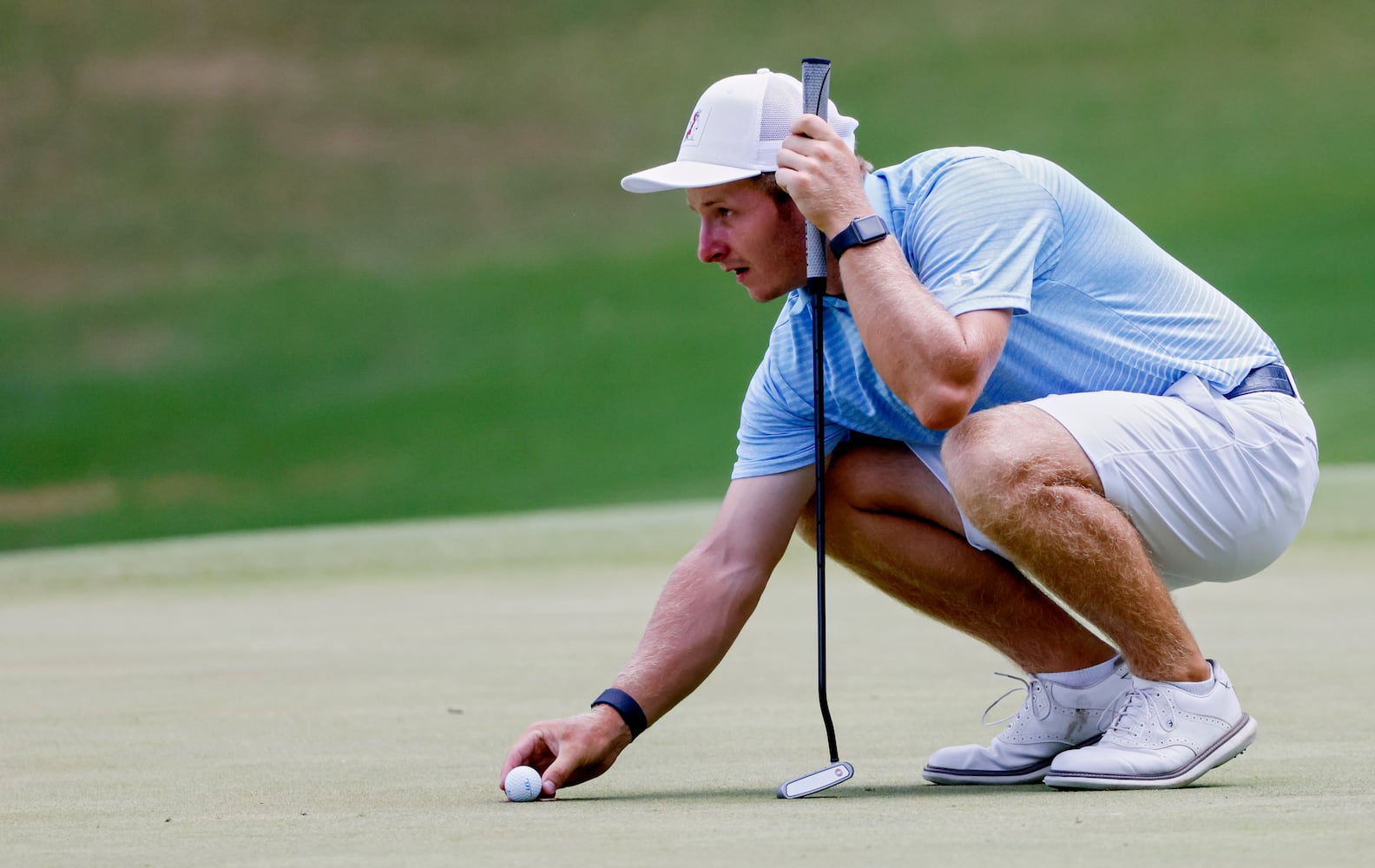 Carson Bacha, from Auburn University, who won the tournament, lines up a putt during the final round of the Dogwood Invitational Golf Tournament in Atlanta on Saturday, June 11, 2022.   (Bob Andres for the Atlanta Journal Constitution)