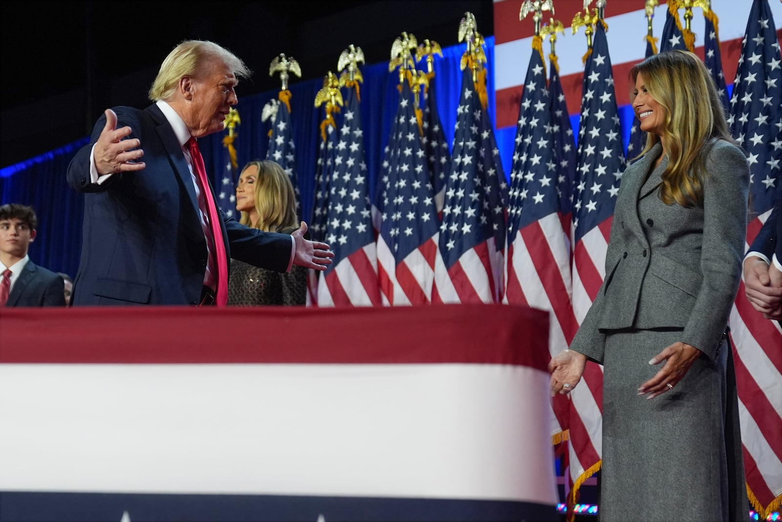 Republican presidential nominee former President Donald Trump smiles at former first lady Melania Trump an election night watch party at the Palm Beach Convention Center, Wednesday, Nov. 6, 2024, in West Palm Beach, Fla. (AP Photo/Evan Vucci)