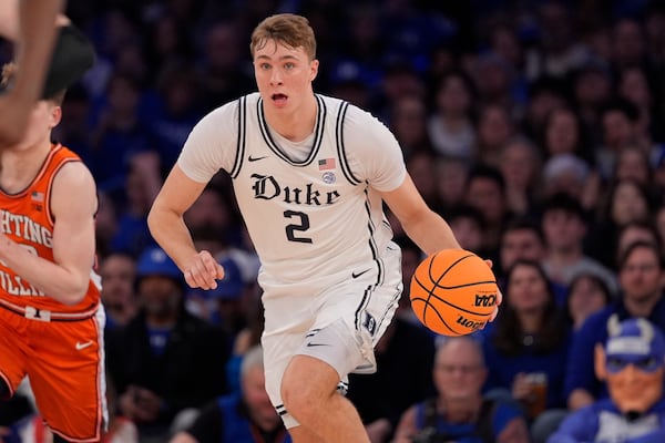 Duke's Cooper Flagg (2) looks to pass during the first half of an NCAA college basketball game against Illinois Saturday, Feb. 22, 2025, in New York. (AP Photo/Frank Franklin II)