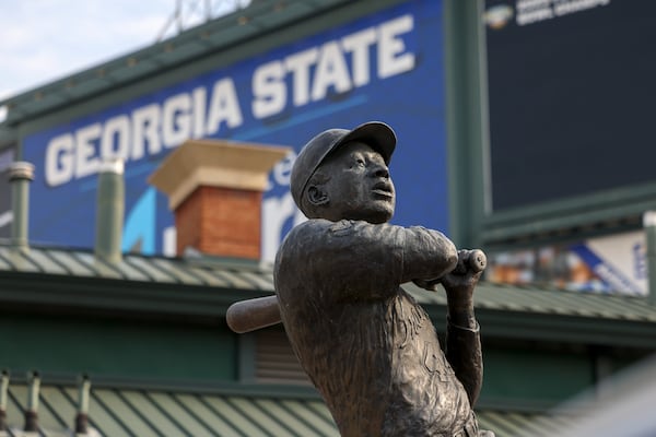 A statue marking Hank Aaron's 715th home run to break Babe Ruth's career record stands at Georgia State University's Center Parc Stadium, formerly Turner Field, where the Atlanta Braves played from 1997 to 2016. Another statue of Aaron could be placed in the National Statuary Hall at the U.S. Capitol if the General Assembly agrees. (Jason Getz / jason.getz@ajc.com)  