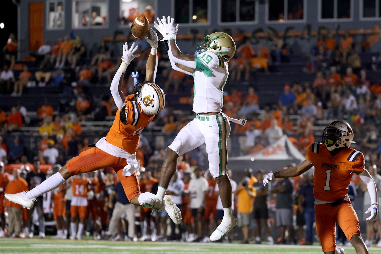 August 20, 2021 - Kennesaw, Ga: North Cobb defensive back Jordan Lonas (13) deflects a pass intended for Buford wide receiver KJ Bolden (19) during the first half at North Cobb high school Friday, August 20, 2021 in Kennesaw, Ga.. JASON GETZ FOR THE ATLANTA JOURNAL-CONSTITUTION