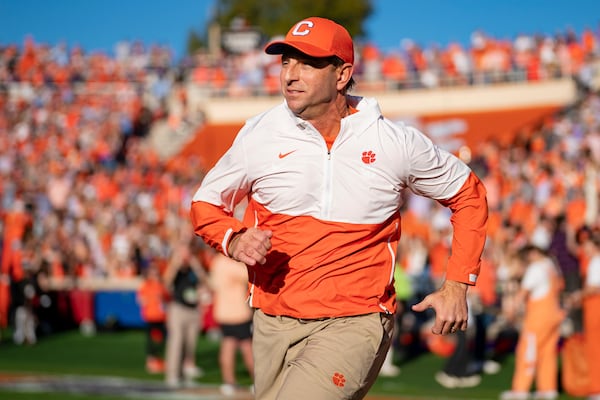 Clemson head coach Dabo Swinney runs onto the field before an NCAA college football game against North Carolina Saturday, Nov. 18, 2023, in Clemson, S.C. (AP Photo/Jacob Kupferman)