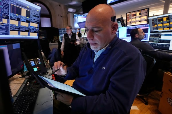 Trader Vincent Napolitano works on the floor of the New York Stock Exchange, Tuesday, March 11, 2025. (AP Photo/Richard Drew)