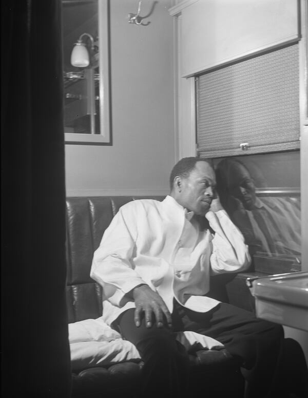 Alfred MacMillan, a Pullman porter, rests in the men's washroom aboard the "Capitol Limited" bound for Chicago, in this photo by Jack Delano from March 1942. (Library of Congress)