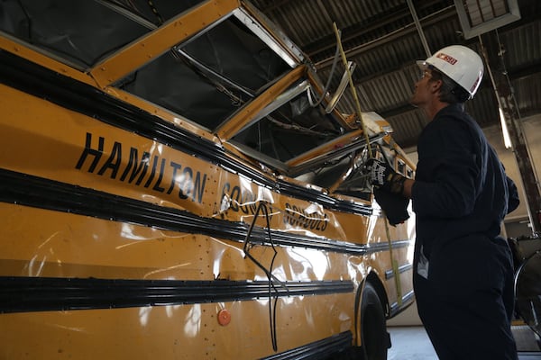 NTSB investigators study the wreckage of a school bus crash on Nov. 21, 2016 in Chatanooga, Tenn. that killed six children. Courtesy of NTSB