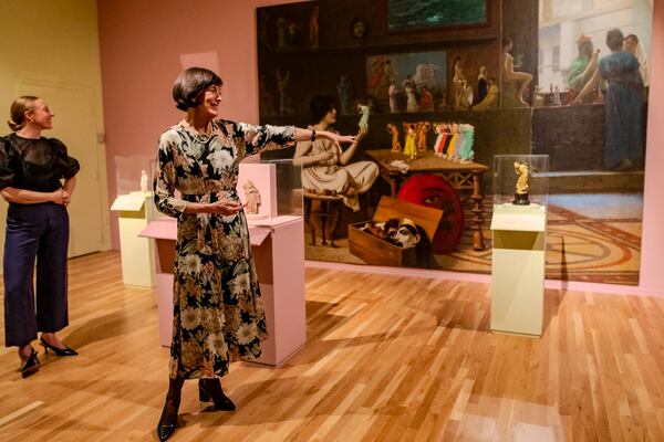 Dr. Ruth Allen, left, and Dr. Linda Merrill, center, led a tour through the gallery for press last Thursday. (Photo Courtesy of Isadora Pennington)