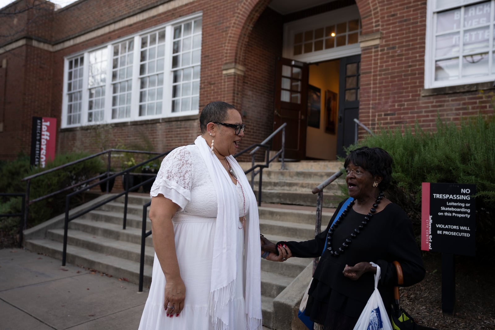 Leslie M. Scott-Jones, left, curator of learning and engagement at the Jefferson School African American Heritage Center, chats with Mattie Louis Spriggs, a close friend, Oct. 10, 2024, in Charlottesville, Va. (AP Photo/Serkan Gurbuz)