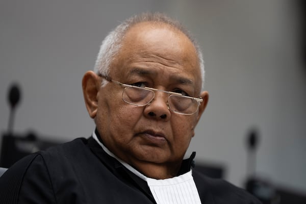 Duterte's lawyer Salvador Medialdea waits for former Philippine President Rodrigo Duterte to appear via video link before the International Criminal Court (ICC) in The Hague, Netherlands, Friday, March 14, 2025. (AP Photo/Peter Dejong, Pool)