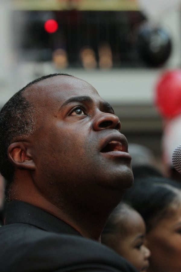 January 27, 2017, Atlanta, Georgia - Mayor Kasim Reed takes a moment to look up at the gathering of Atlanta citizens and Falcons fans at the Atlanta Falcons pep rally at City Hall on Friday. (Henry Taylor / henry.taylor@ajc.com)