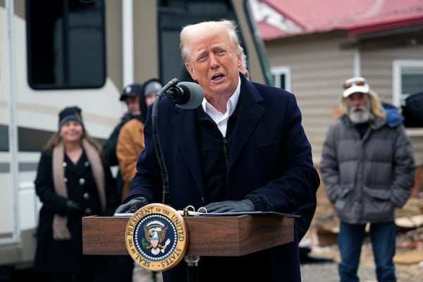 President Donald Trump speaks as he meets with homeowners affected by Hurricane Helene in Swannanoa, N.C., Friday, Jan. 24, 2025. (AP Photo/Mark Schiefelbein)